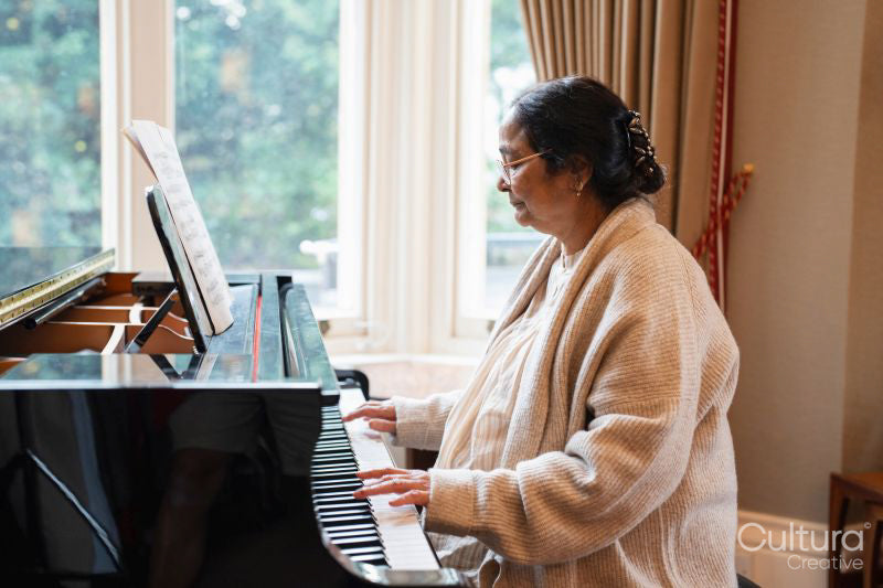 Senior woman playing piano