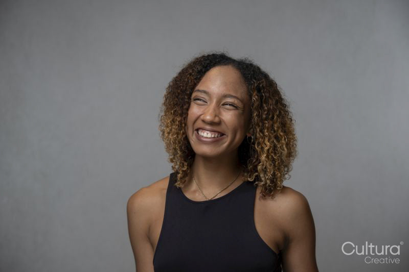Portrait of smiling woman with curly hair