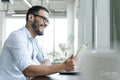 Businessman with laptop working in modern office