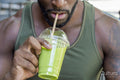 Mid adult man drinking smoothie