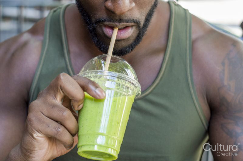 Mid adult man drinking smoothie