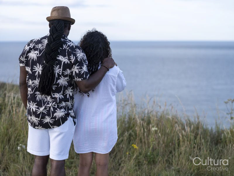 Couple looking at sea from cliff