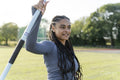 Portrait of confident female athlete holding javelin