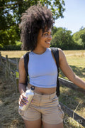 Portrait of young woman hiking in countryside