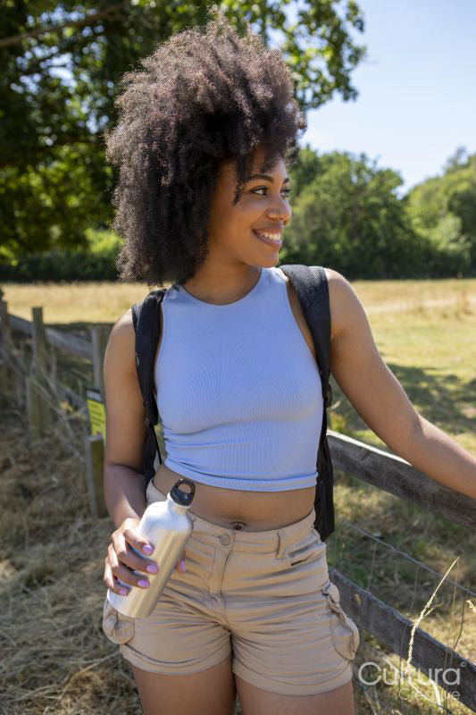 Portrait of young woman hiking in countryside