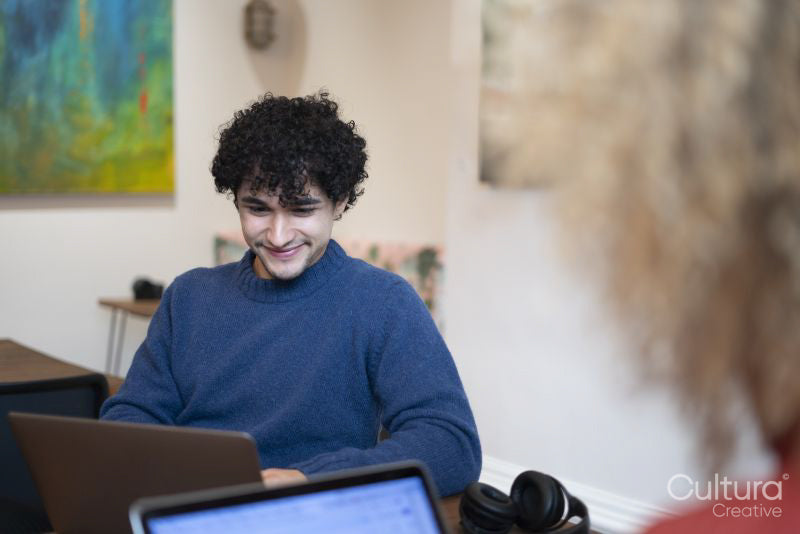 Man working on laptop in office