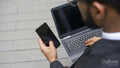 Business man using laptop and mobile phone