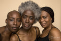 Studio portrait of three smiling women