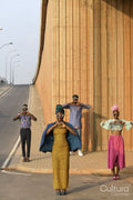 Fashion shot of four people standing in urban street