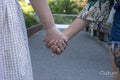 Close-up of couple holding hands