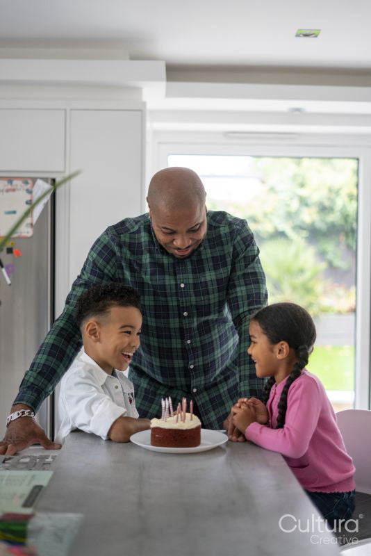 Family celebrating birthday at home