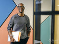 Portrait of man holding folders