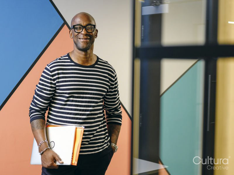 Portrait of man holding folders