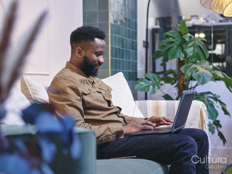 Man using laptop in modern office