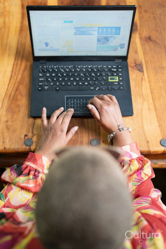 Mature woman using laptop at home