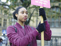 Portrait of woman protesting with placard