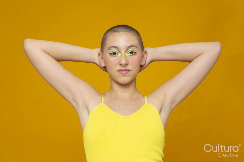 Studio portrait of girl with neon colored make-up