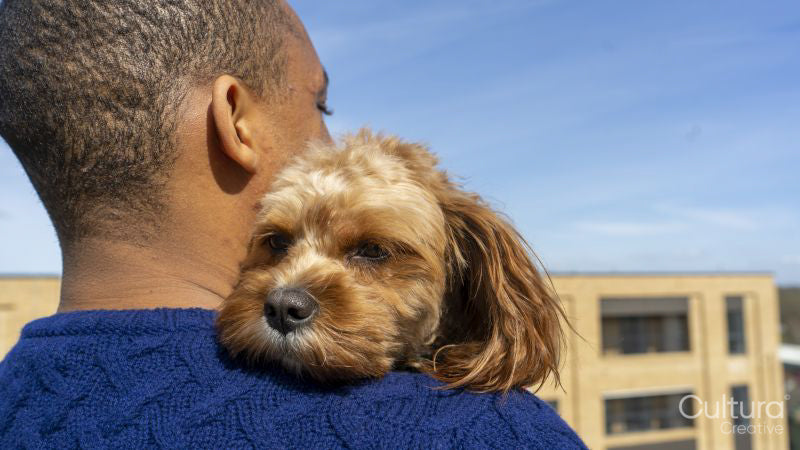 Man holding dog