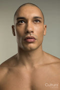 Studio portrait of serious shirtless man