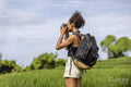 Indonesia, Bali, Female tourist photographing field
