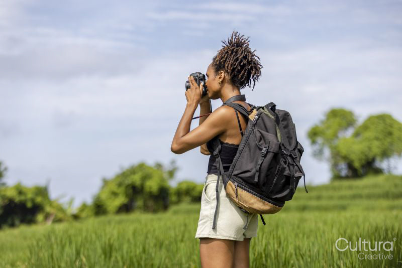 Indonesia, Bali, Female tourist photographing field