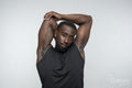 Portrait of muscular man stretching arms