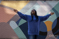 South Yorkshire, Woman with braided hair against colorful wall