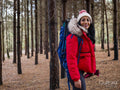Female backpacker hiking in forest
