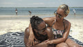 Couple relaxing on beach