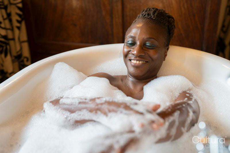 Senior woman taking bubble bath