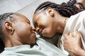 Portrait of smiling couple lying on floor at home