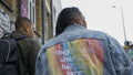 Two women walking in city, rear view