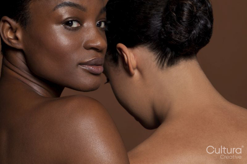 Portrait of young women against brown background