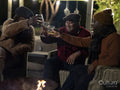 Male friends relaxing on patio and raising toast