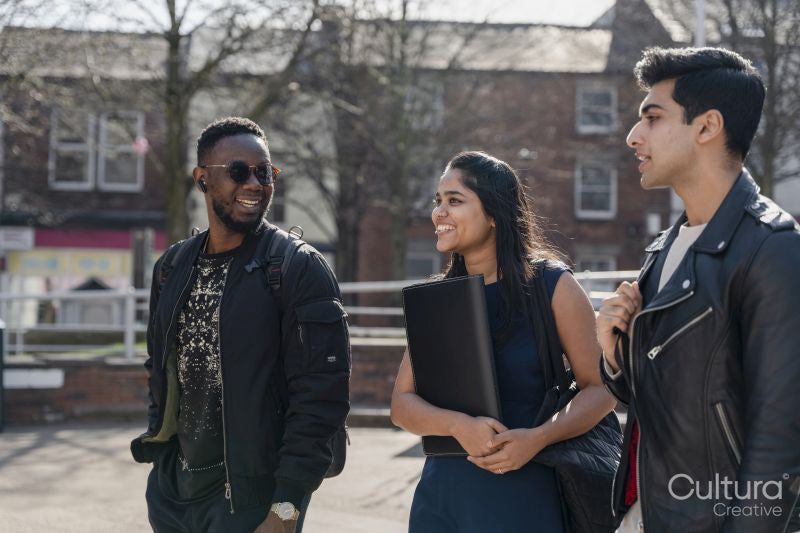 Group of student friends walking on campus