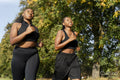 Young female friends jogging in park