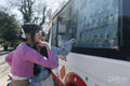 Young women buying ice cream in park