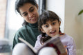Mother and daughter reading book