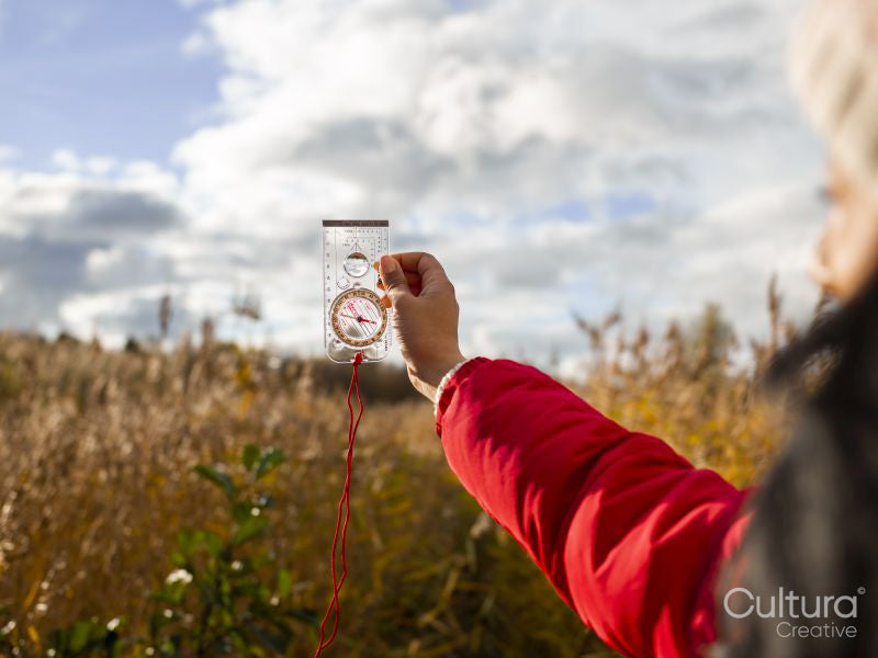 Female hiker using compass