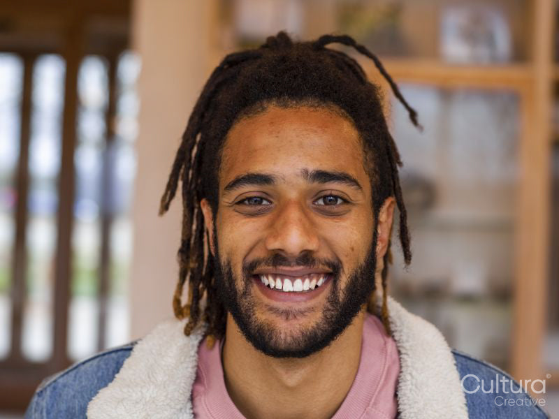 Portrait of young man with dreadlocks