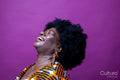 Studio shot of laughing woman with big hair