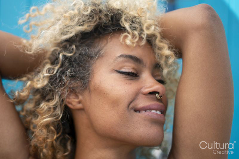 Close-up of smiling woman with curly hair