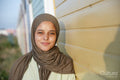 Portrait of young Muslim woman looking at camera on sunny day