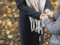 Women standing in park and holding hands
