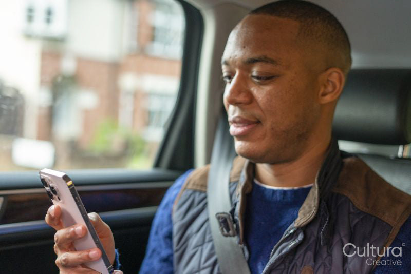 Man using phone in car