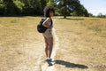 Young woman with backpack hiking in countryside