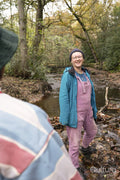 Female friends walking in forest