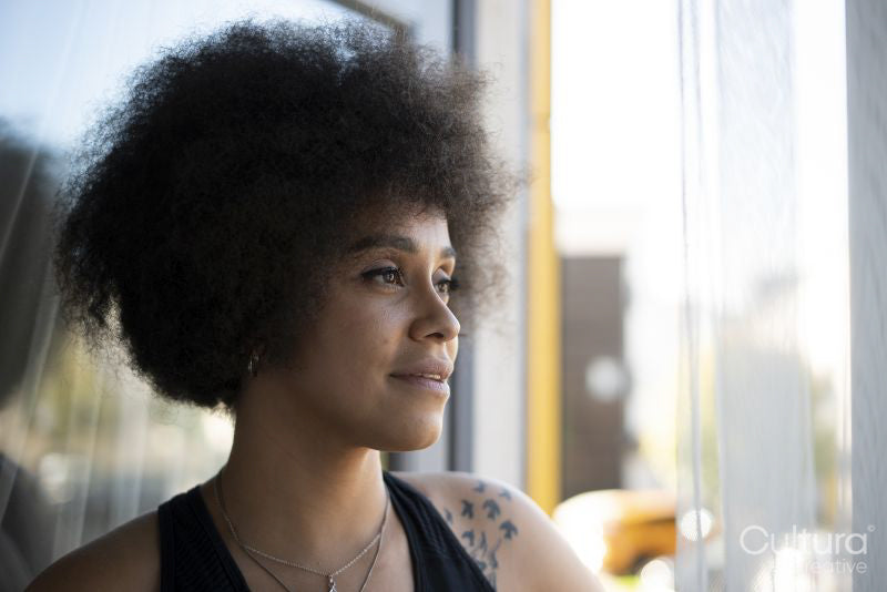 Smiling woman with curly hair