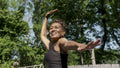 Senior woman doing yoga outdoors