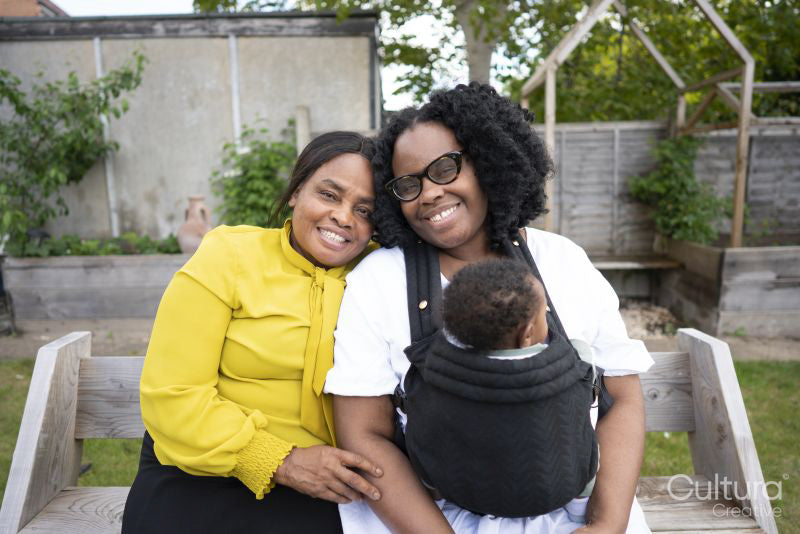 Portrait of grandmother with adult daughter and baby grandson